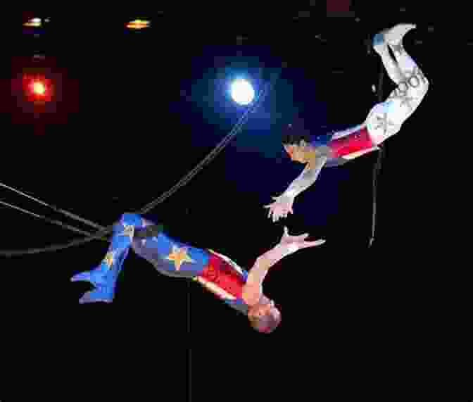 A Group Of Acrobats Performing On The Flying Trapeze. Ringmaster : My Year On The Road With The Greatest Show On Earth
