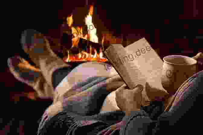 Person Reading A Book By The Fire Hygge: How To Practice The Danish Art Of Coziness